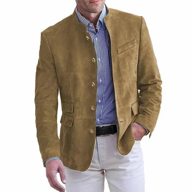 Male model dressed in a sleek button-front blazer with a refined silhouette on a plain background.