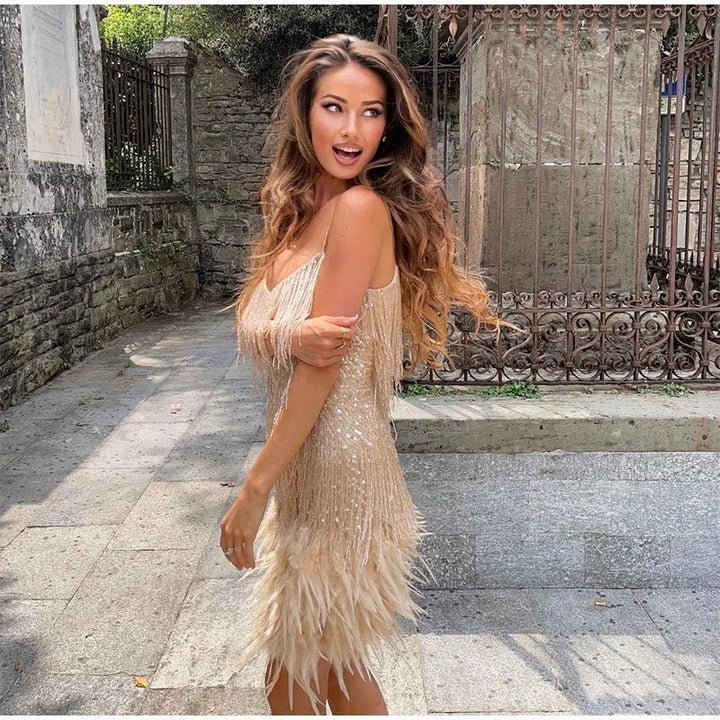 Model in a sparkling event dress displayed against a plain background.