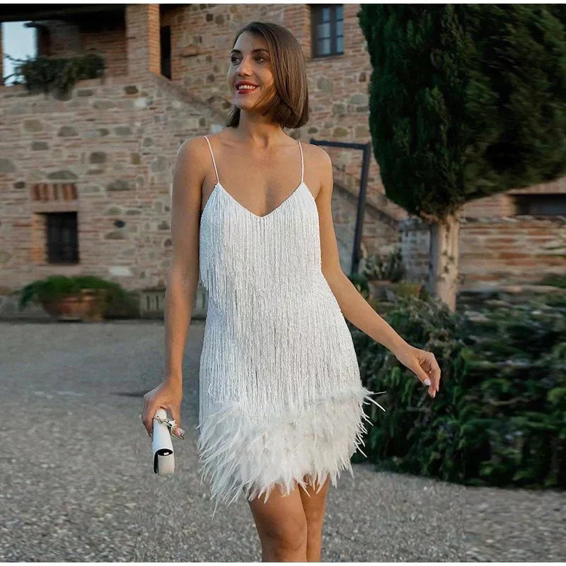  Woman in a fitted glitter party dress shown against a plain background.