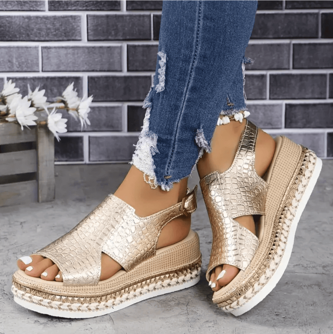 Women’s heeled sandal displayed from front angle on plain background.