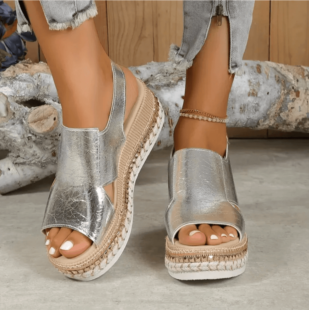 Front-facing image of women’s sandal with secure ankle strap.