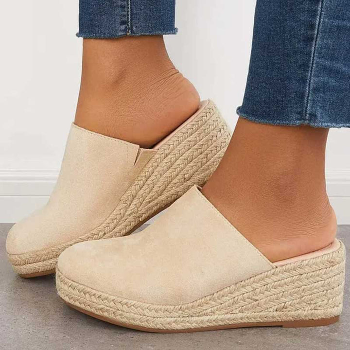 Front view navy slip on wedge mule plain background image