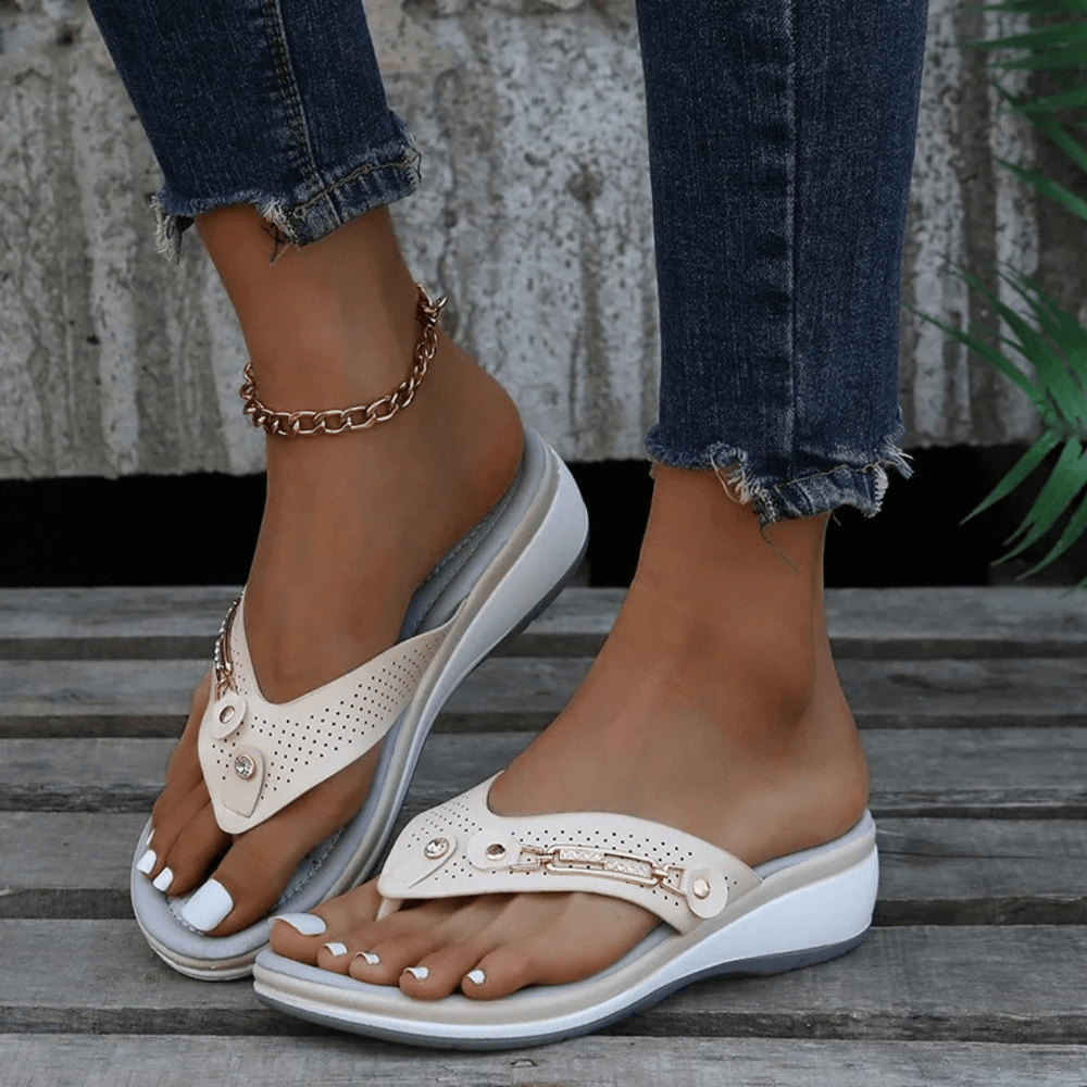 Front view of stylish casual flip-flops worn by foot model.