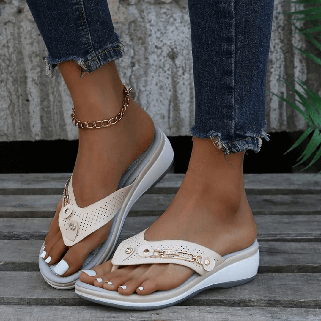 Front view of stylish casual flip-flops worn by foot model.