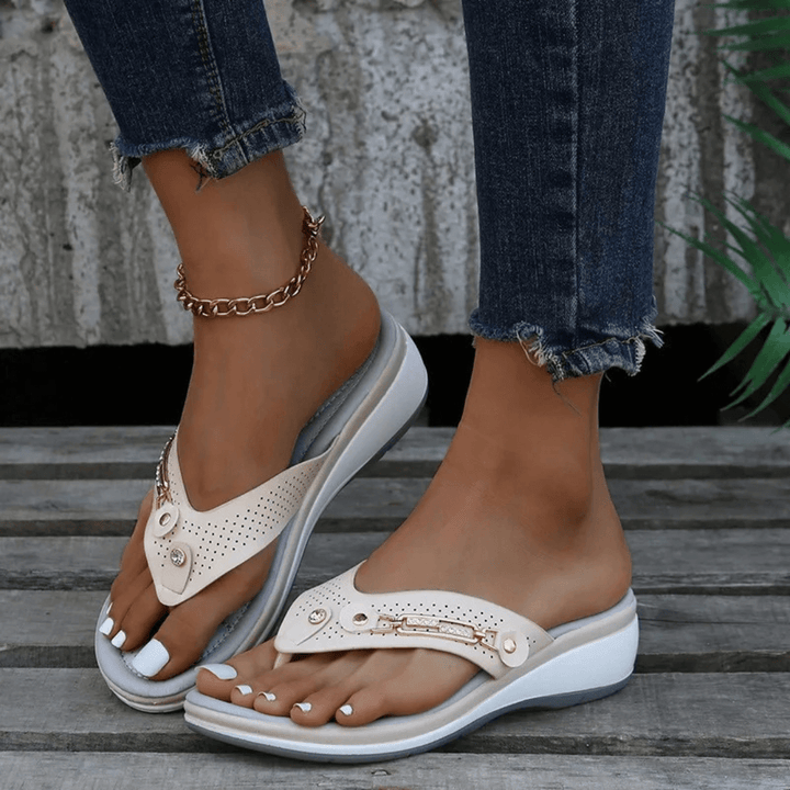 Front view of stylish casual flip-flops worn by foot model.