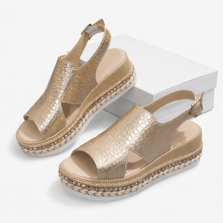 Breathable wedge sandals on a plain background.
