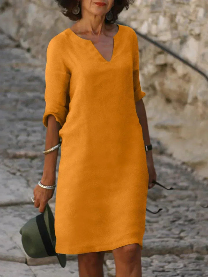 Orange shift dress with soft drape front