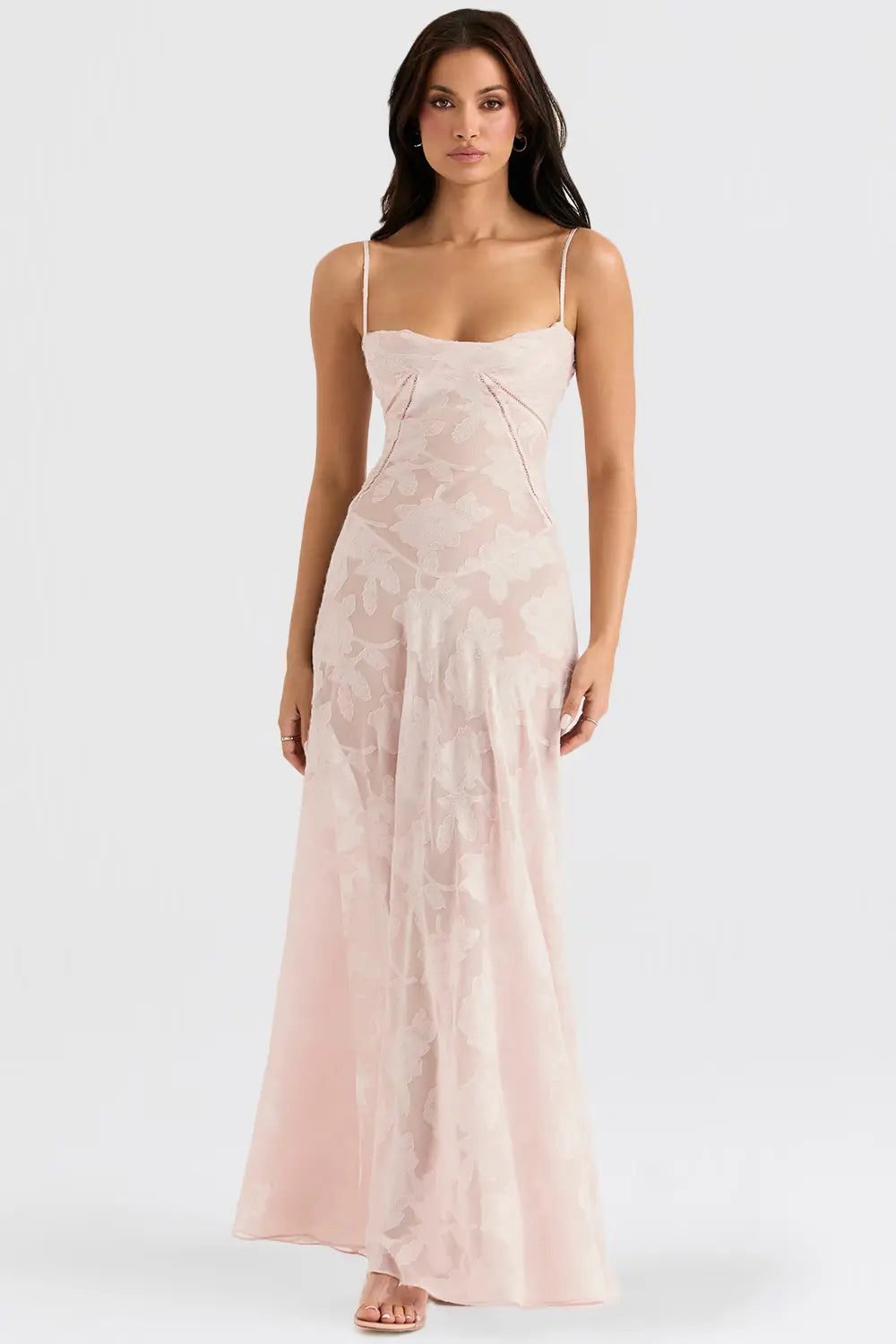 Sleeveless flowing dress styled on a female model against a clean background.