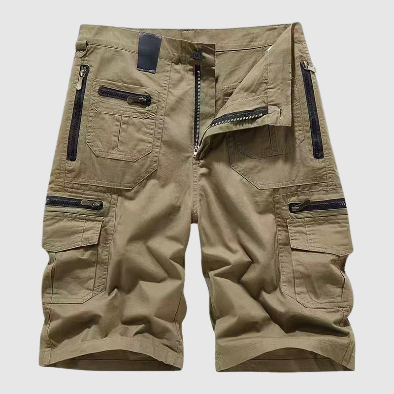 Female wearing utility cargo pants with multiple pockets on a plain background.