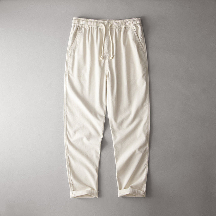 Lightweight casual pants with a comfortable silhouette on a plain background.