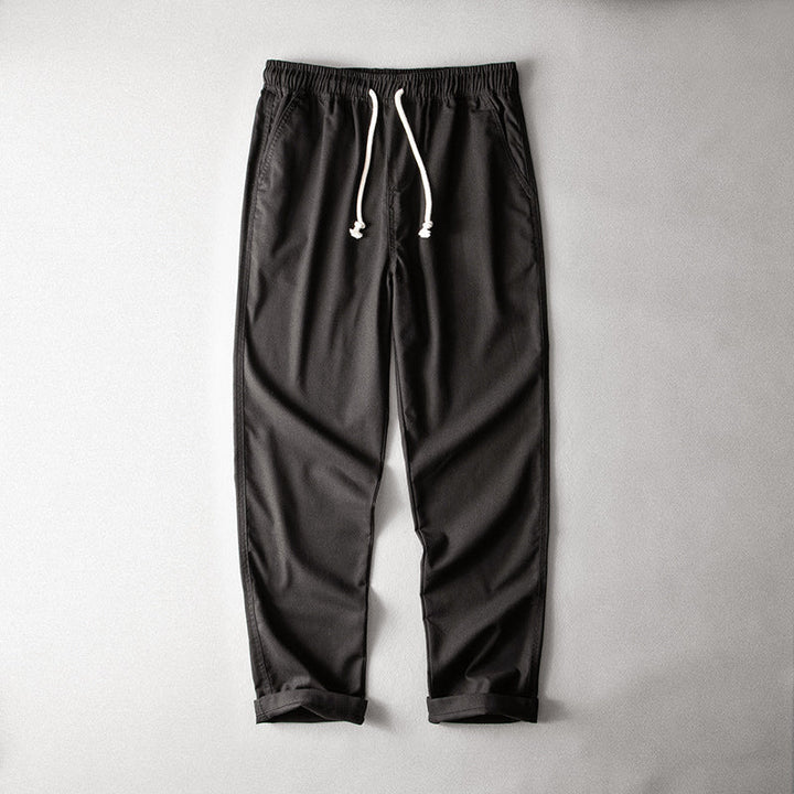 Airy drawstring pants designed for everyday wear on a plain background.