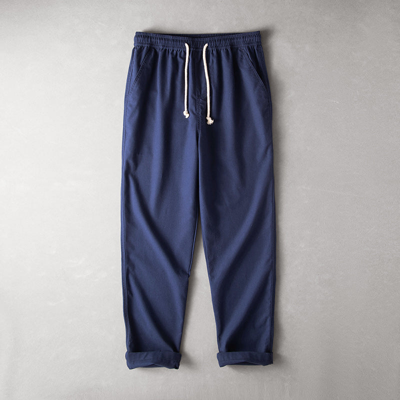 Versatile drawstring waist pants on a plain background.