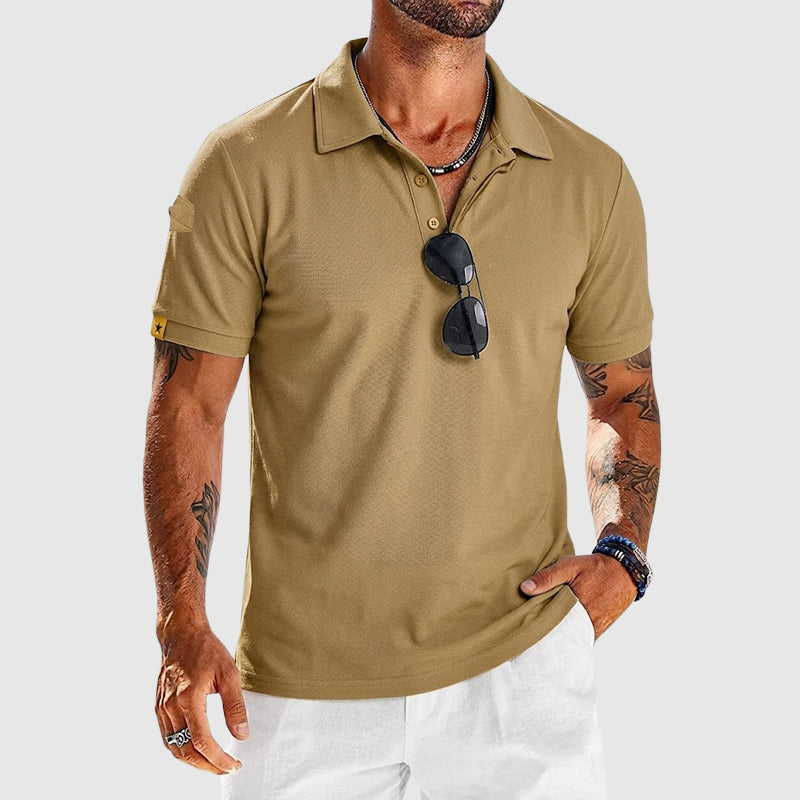 Male model wearing a textured short sleeve polo on a plain background.
