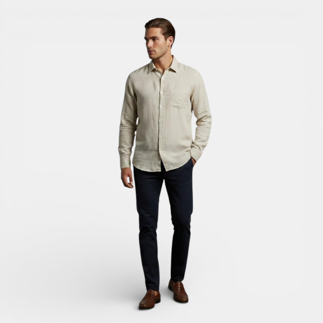  Woman wearing a soft relaxed shirt styled for warm weather on a plain background.