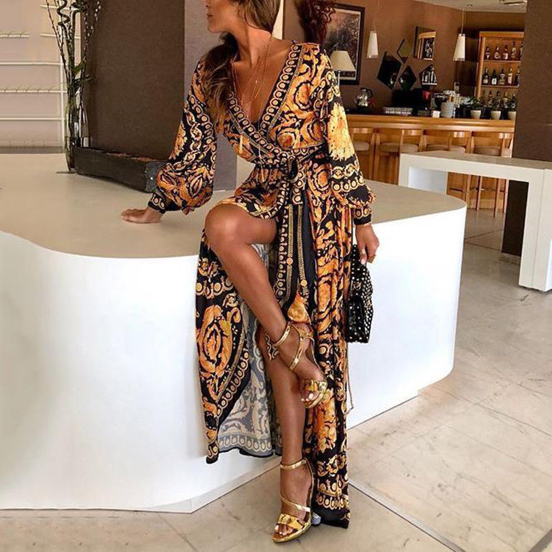 Woman model wearing a bohemian wrap maxi dress on a plain background.