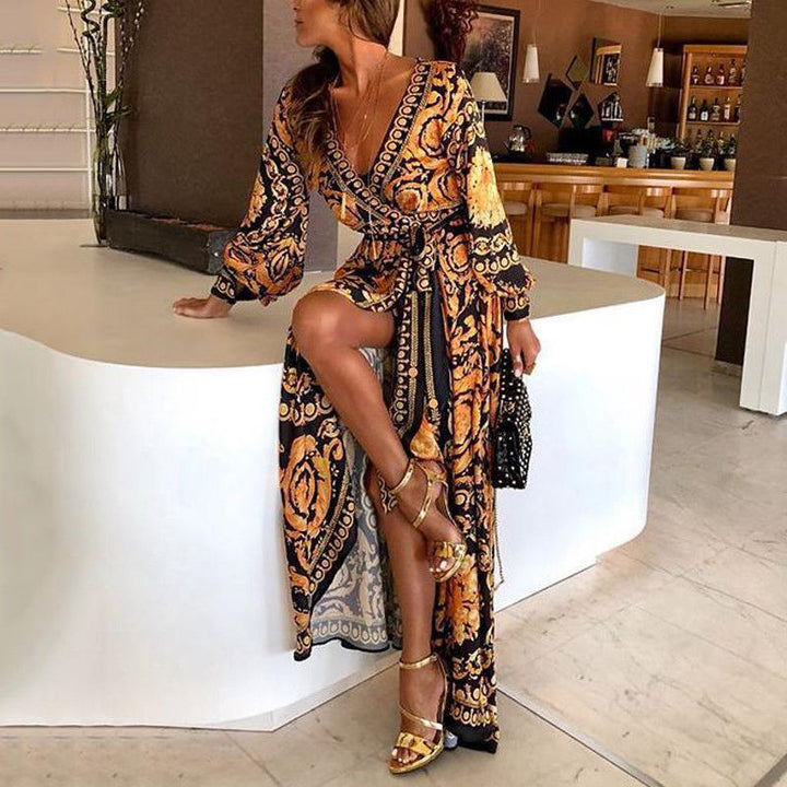 Woman model wearing a bohemian wrap maxi dress on a plain background.