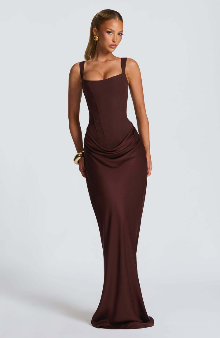 Woman close up neckline detail sleeveless dress plain gray background