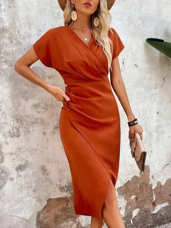 Female model in an elegant wrap-style midi dress with a flattering silhouette.