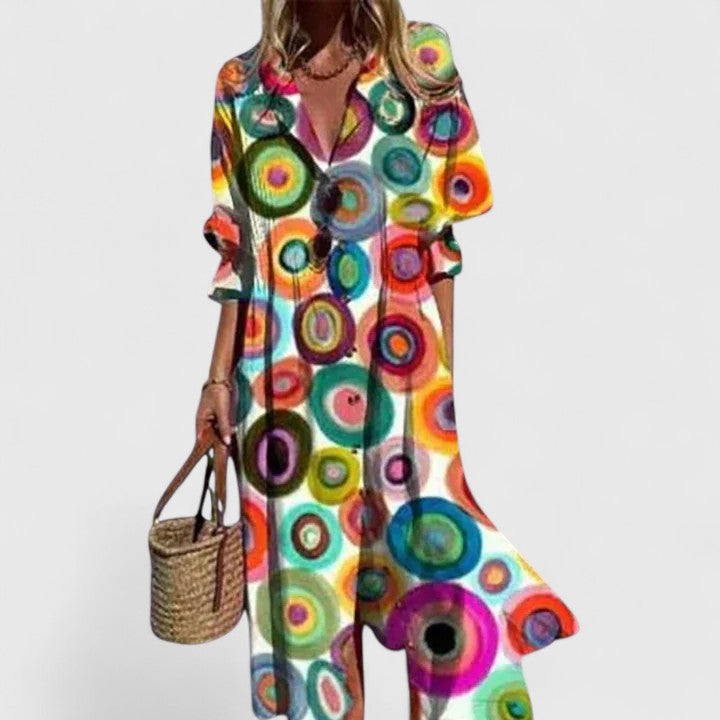 Woman model in a stylish floral maxi dress with modern split front design.