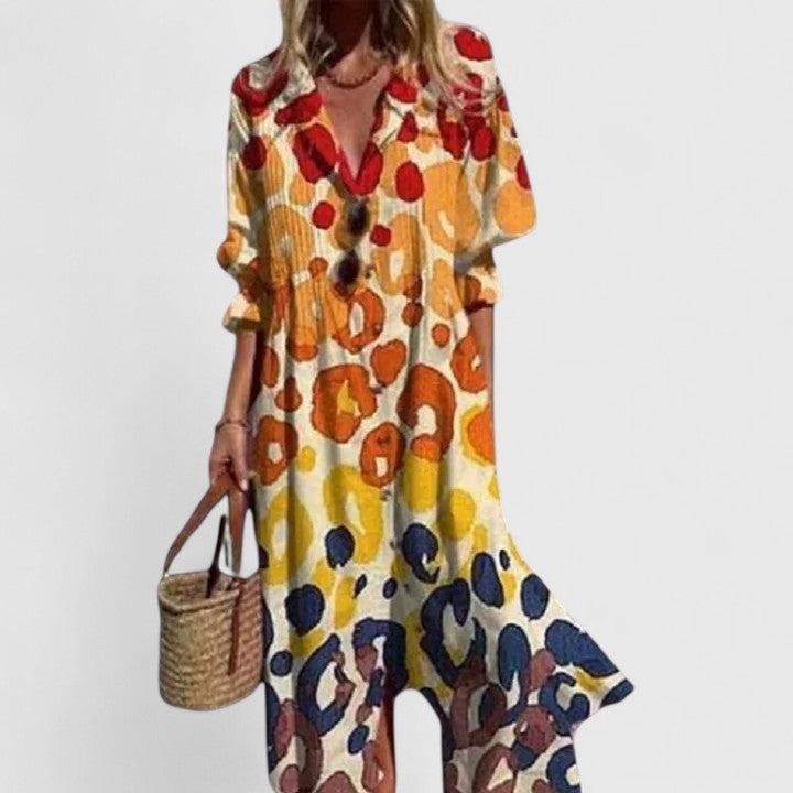 Female model wearing an elegant floral long sleeve maxi dress against a clean background.