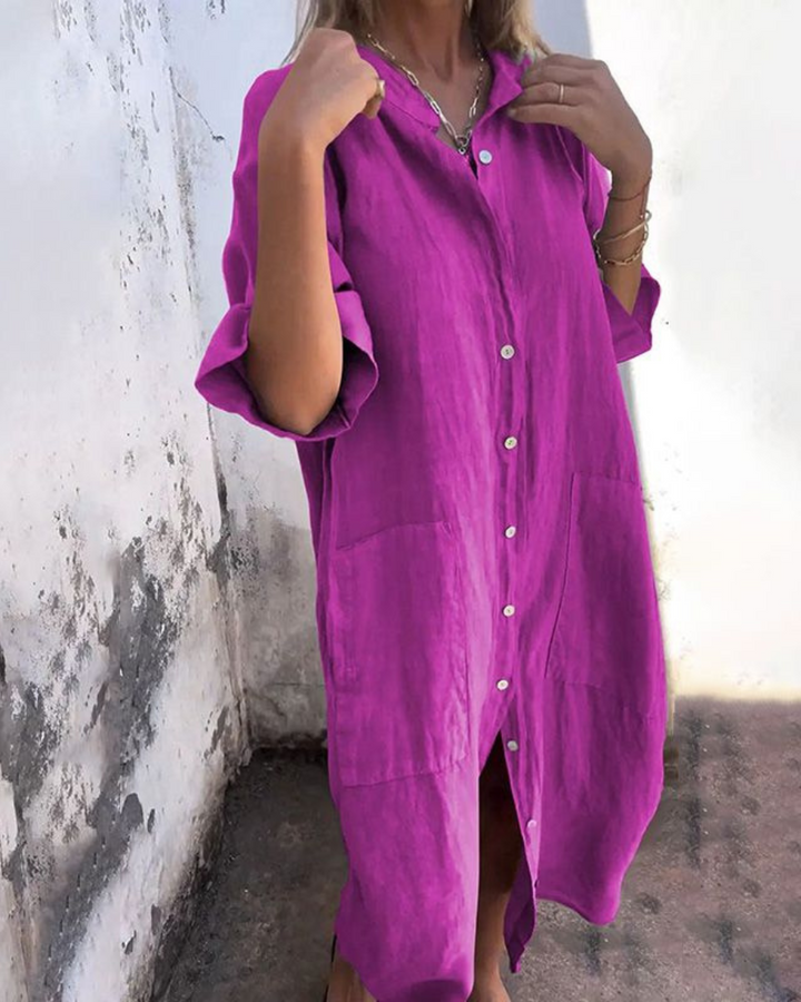 Woman model styled in a versatile button-down dress with midi length on a plain background.