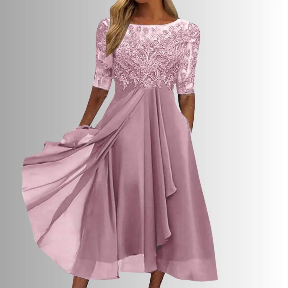 Embroidered bodice A-line midi dress shown on a woman model against a clean background.
