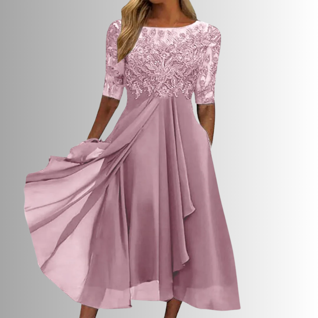 Embroidered bodice A-line midi dress shown on a woman model against a clean background.