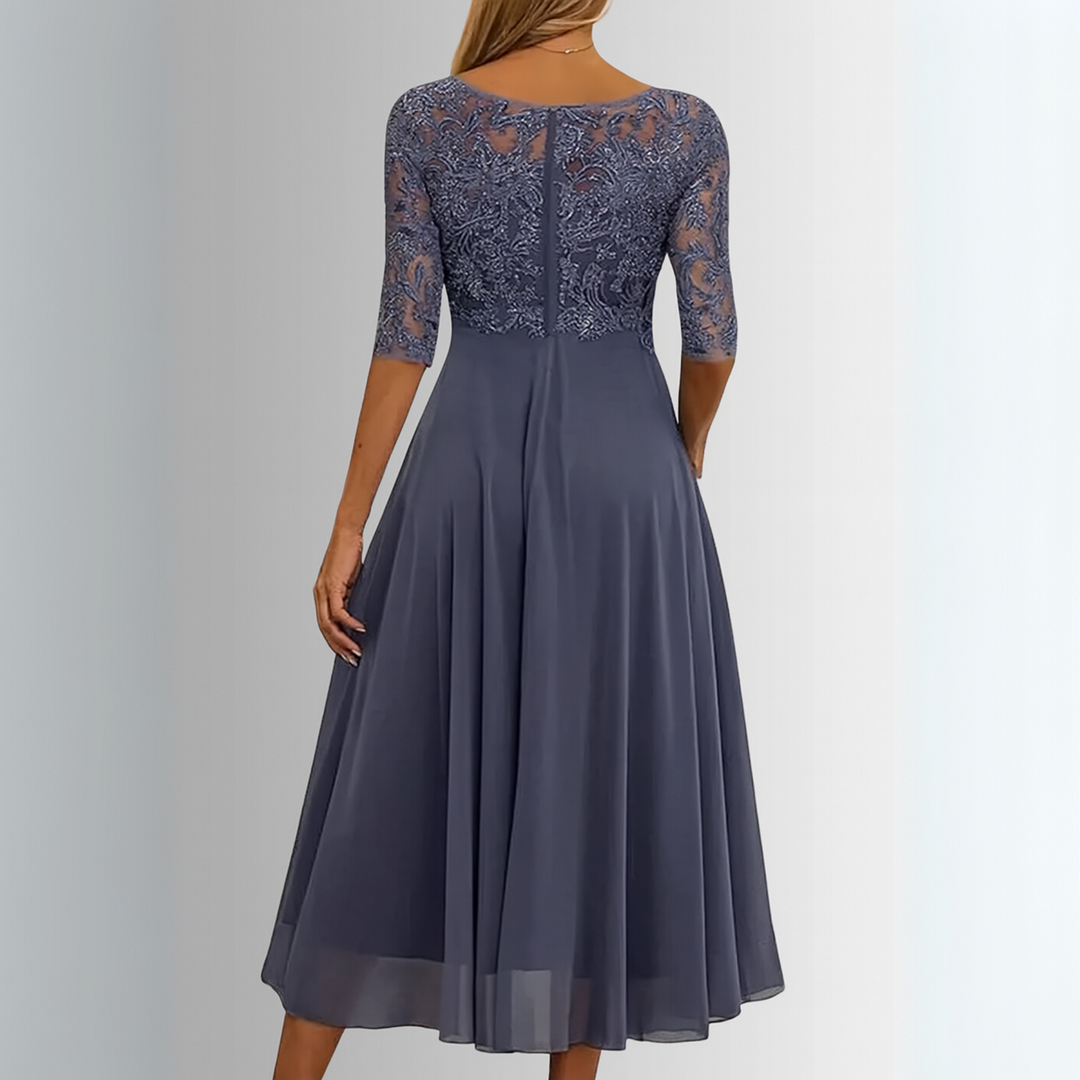 Lace embroidered A-line dress with midi length shown on a woman model, back view
