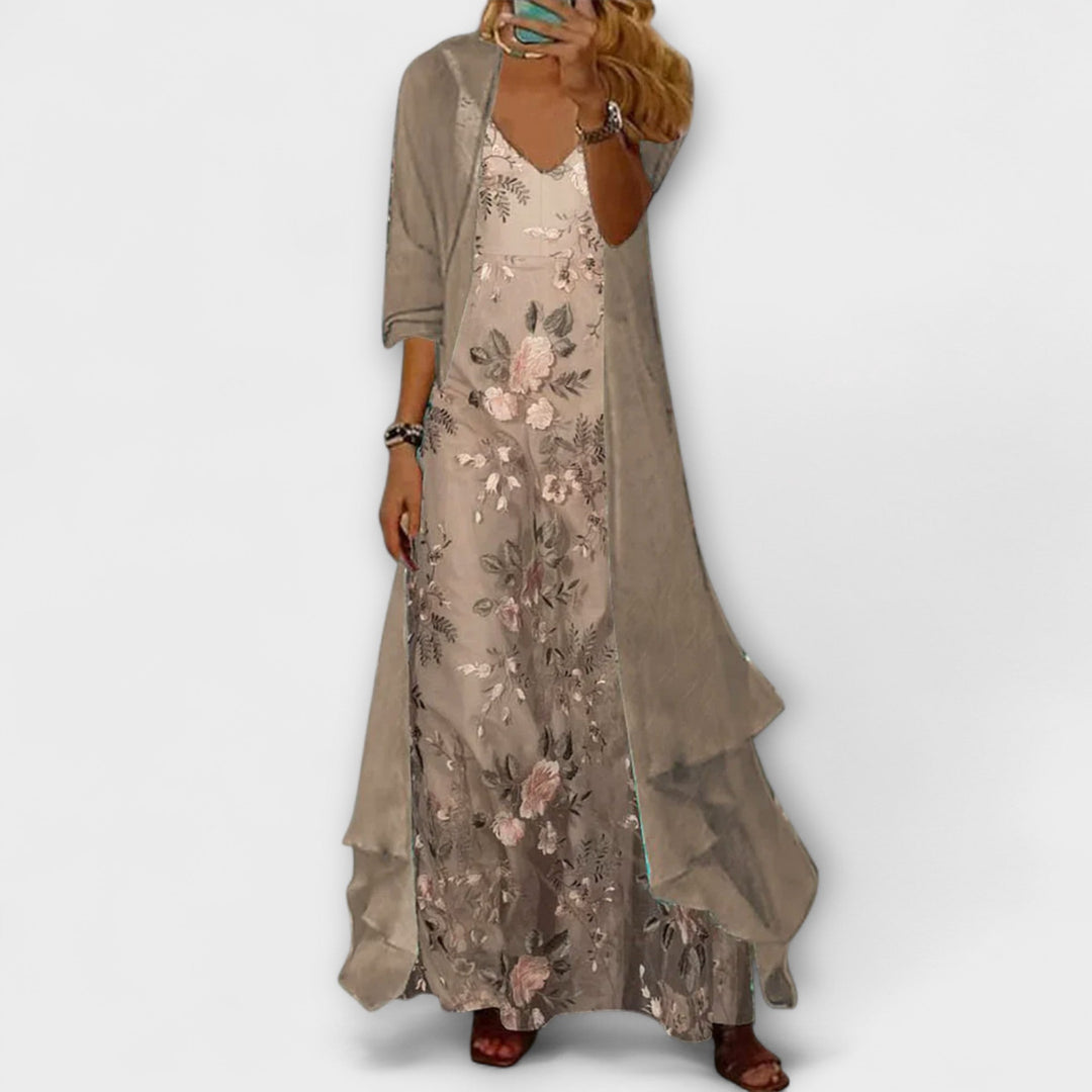 Woman model wearing a floral maxi dress on a clean background.