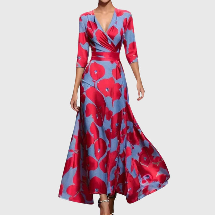 Woman model wearing a floral maxi wrap dress against a plain background.