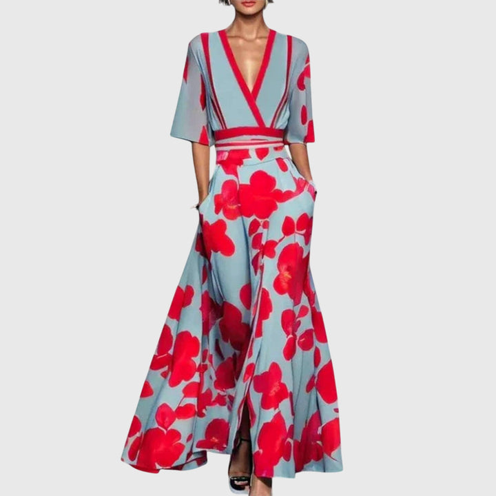 Model in a v-neck floral maxi dress on a clean background.