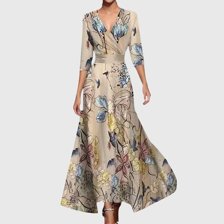 Female showcasing a floral wrap maxi dress with 3/4 sleeves.