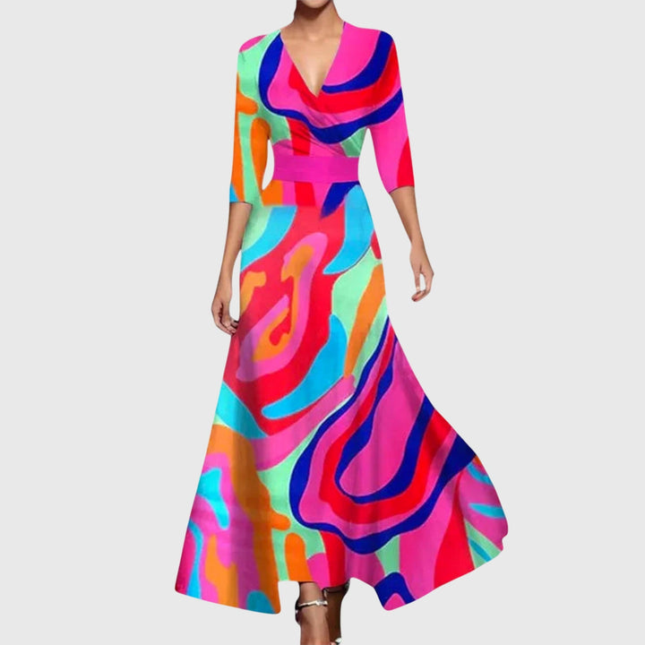 Lady showcasing an elegant floral v-neck dress on a plain background.