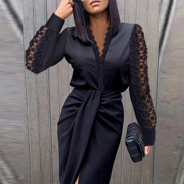 Model in a fitted V-neck midi dress with lace sleeves on a clean background.