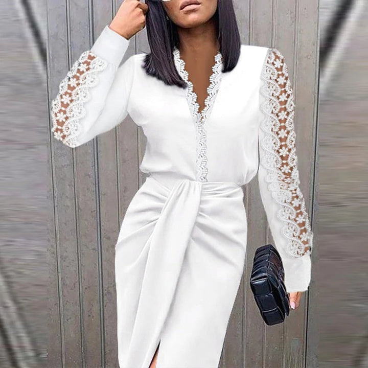 Woman model wearing an elegant lace sleeve midi dress against a plain background.