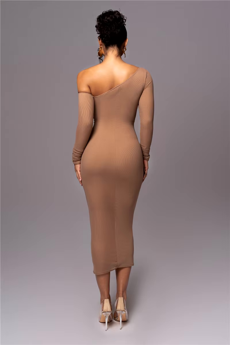 Woman model showcasing a bodycon ruched midi dress on a plain background, back view