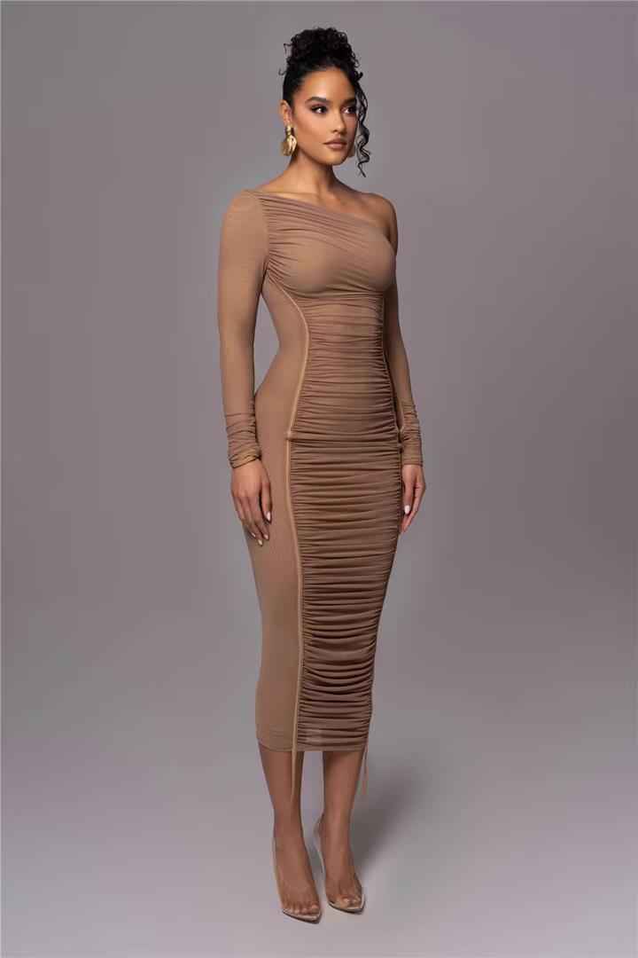 Woman model in an elegant one-shoulder midi dress with flattering ruching.