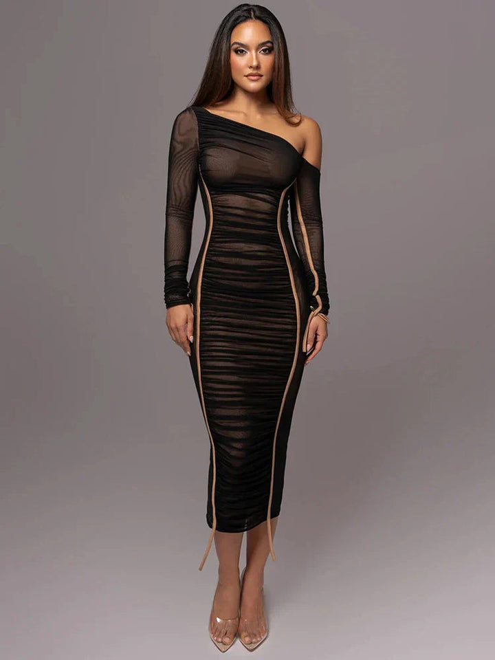 Woman model styled in a sleek one-shoulder ruched dress on a plain background.
