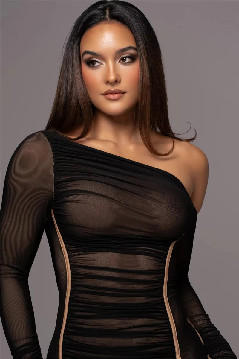 model showcasing a flattering ruched dress with midi length.
