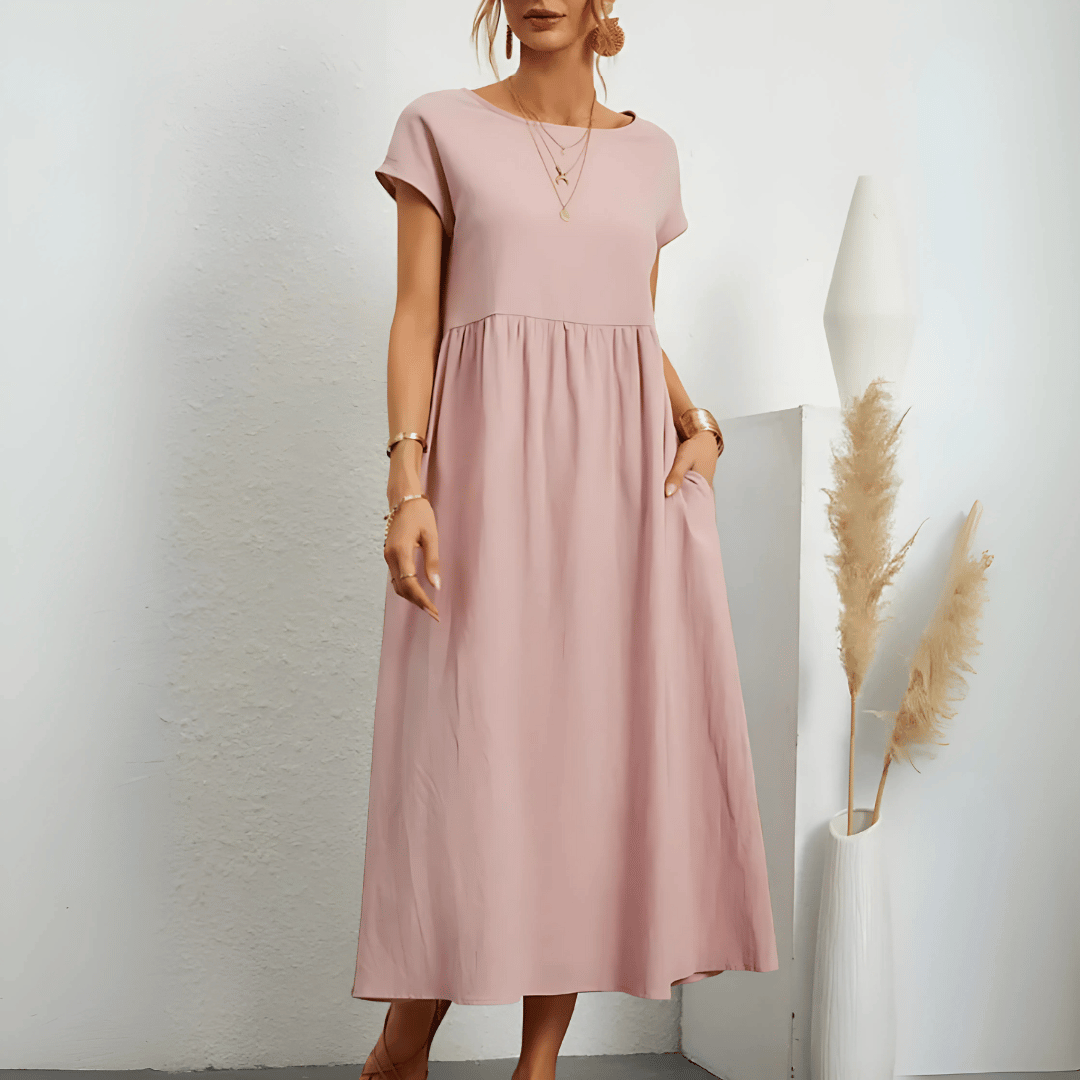 Model showcasing a breezy empire waist A-line midi dress.