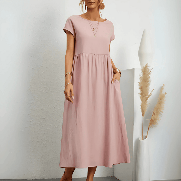 Model showcasing a breezy empire waist A-line midi dress.