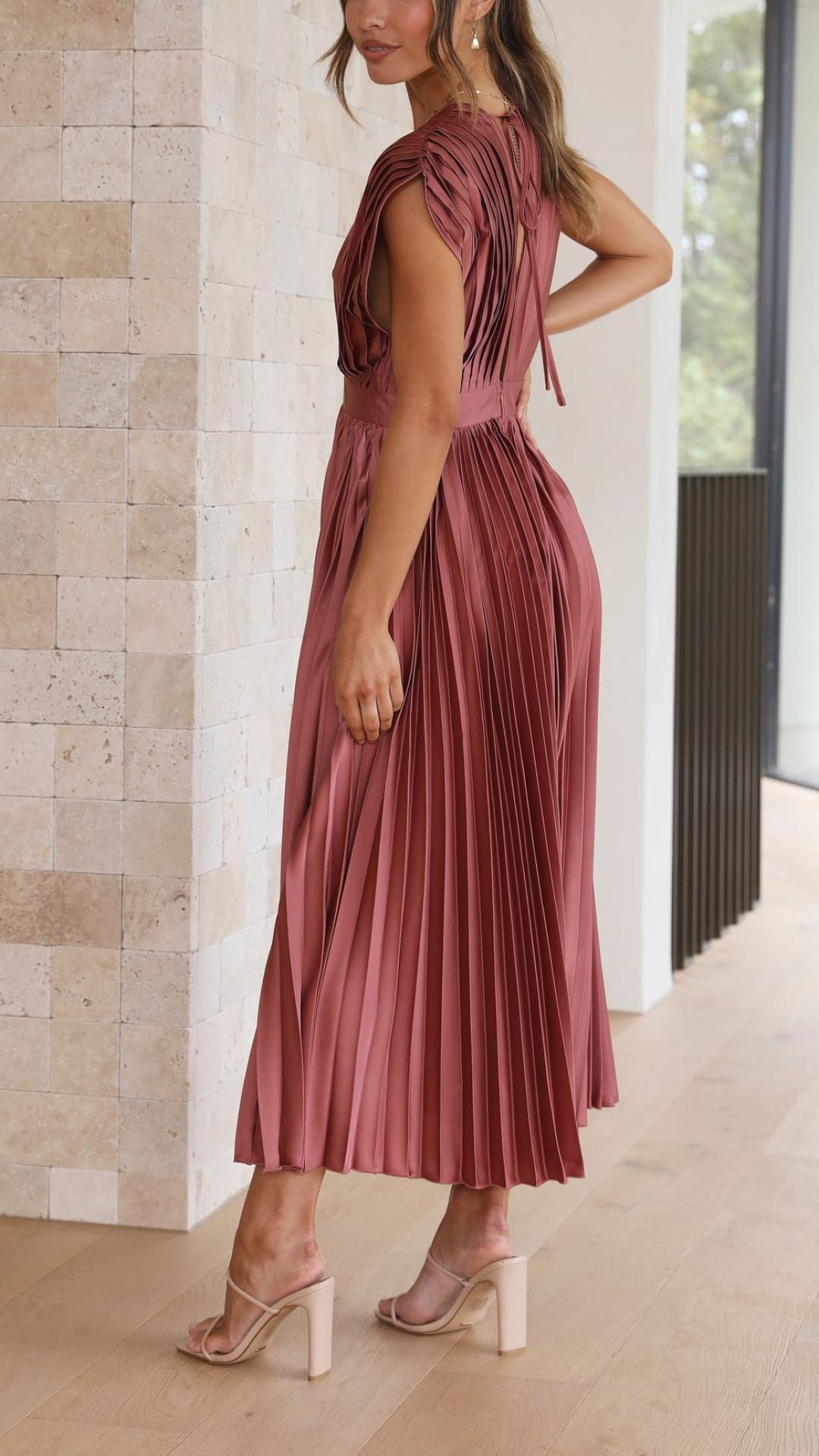 Sleeveless A-line midi dress shown on a woman model with a clean background.
