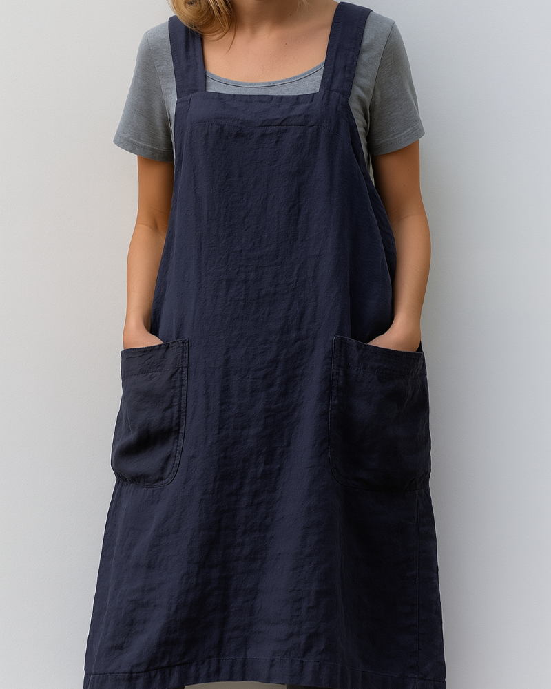Woman model showcasing a square neck sleeveless midi dress with patch pockets.