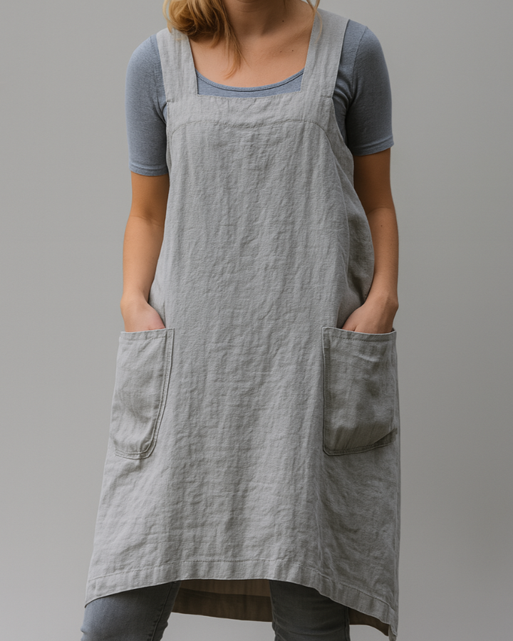 Woman model in a square neckline sleeveless dress with a relaxed silhouette.