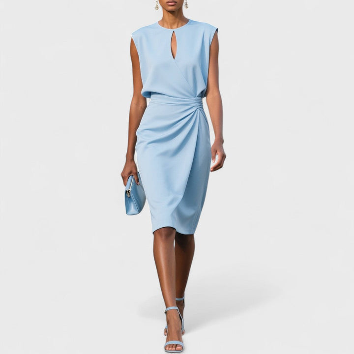 Woman model wearing a sleeveless wrap front midi dress on a plain background.