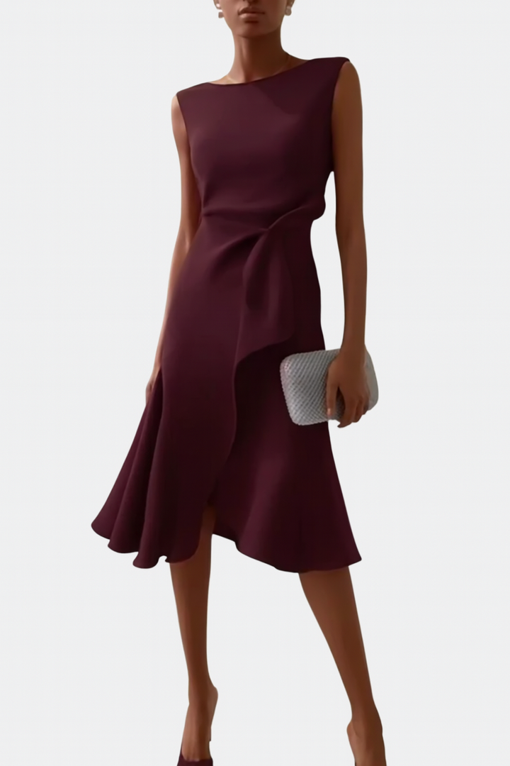Modern wrap midi dress styled on a woman model with clean backdrop.