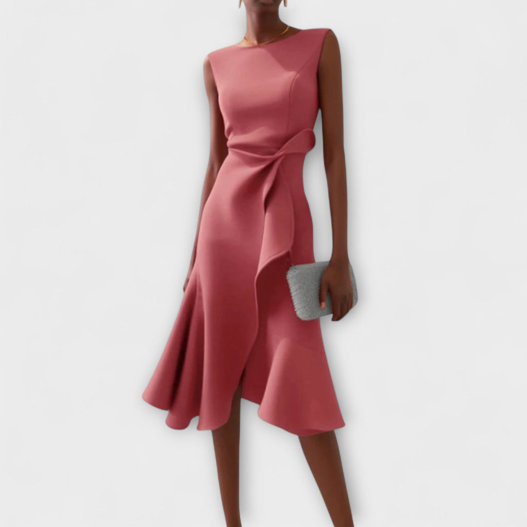 Sleeveless asymmetrical midi dress showcased on a woman model with clean backdrop.