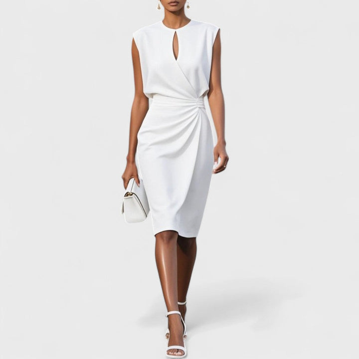 Model in a clean midi cut dress with wrap front detail.