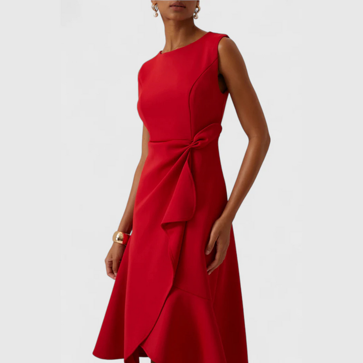 Woman model highlighting a flattering wrap silhouette in a midi dress.