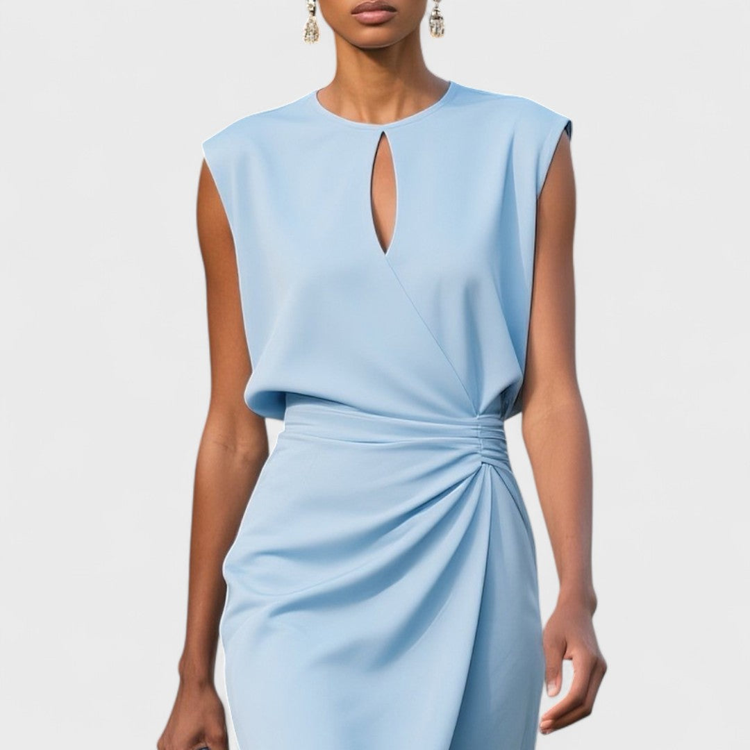 Clean sleeveless midi dress with wrap-style front on woman model.
